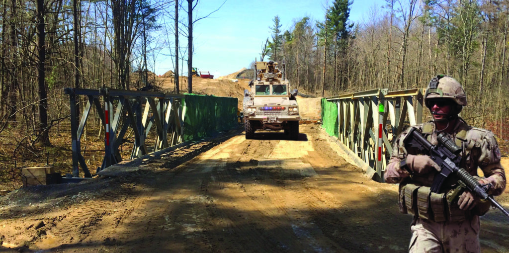 Armoured military vehicle crossing modular panel bridge