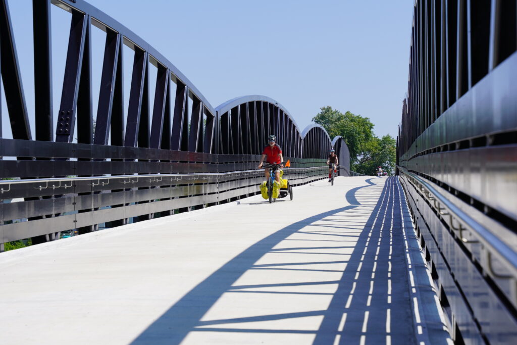 Cyclists on prefabricated trail bridge