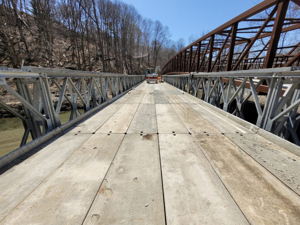 End view of Bailey-Bridge-style construction access bridge