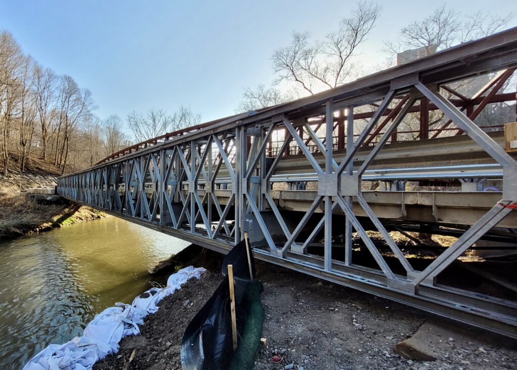 Angled view of Bailey-Bridge-style construction access bridge